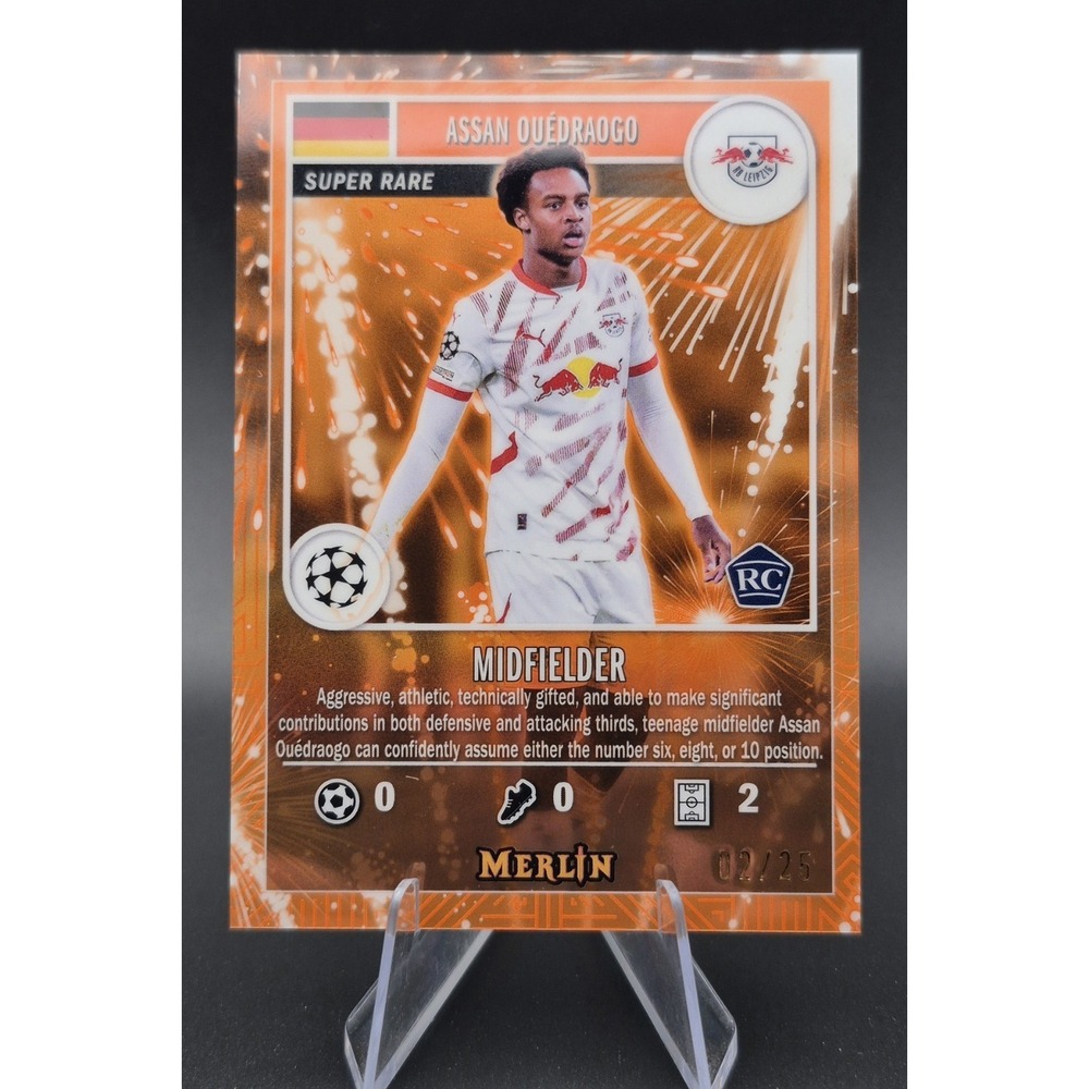 2025‎ Topps Merlin Collection Assan Ouedraogo #MG-37 Super Rare Orange /25 (RC)